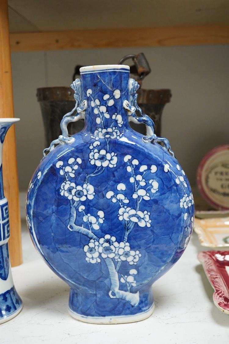 A Chinese blue and white prunus flower moon-flask and a Gu vase, largest 30cm high
